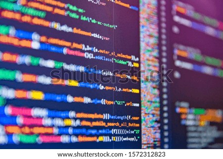 Software technology background showing programming source code on computer screen.