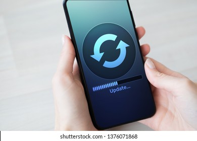 Software Update Downloading Progress On Smartphone Screen. Internet And Technology Concept.