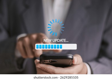 Software update or operating system concept, upgrades to keep your device up to date with enhanced functionality in new versions. Businessman using smartphone with update bar on virtual screen.