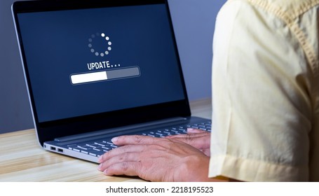 Software update or operating system upgrade to keep the device up to date with added functionality in new version and improve security. Updating progress bar on computer screen. Installing app patch.