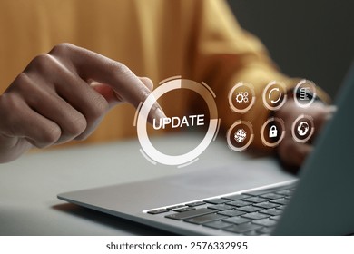 Software update or operating system upgrade concept. Improved functionality in the new version and improved security. Person using laptop with Software update and upgrade technology.