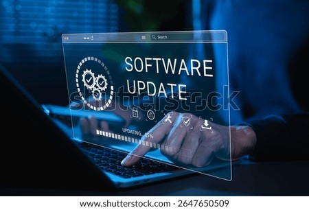 Software Update and System Upgrade Concept. Person holding phone while using laptop with software update progress interface and security, technology maintenance, application upgrades, system security.