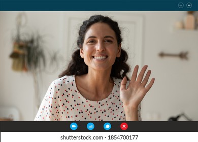 Software video call computer application screen view smiling attractive woman waving hand at camera, greeting colleagues or friends starting online conversation, distant communication concept.