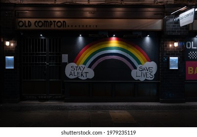 Soho, London - 26th March 2021 - A Store Front Displaying 'stay Alert, Save Lives' Message In London's West End