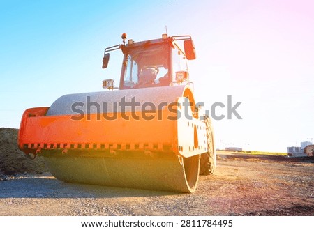 Soil Compactor on compact the road surface during road construction. Road compaction equipment at construction site. Vibration single-cylinder road roller, Vibratory Soil Compactor. Single Drum Roller on highway construction.