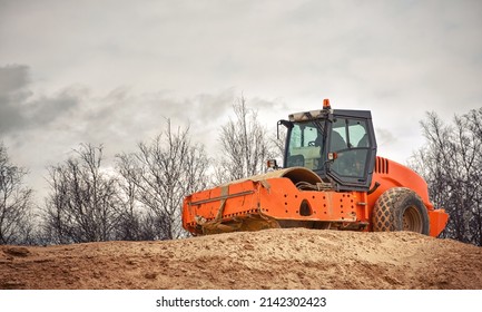 Soil Compactor With Smooth Drum. Soil Compactor For Leveling Ground, Road Construction. Road Compaction Heavy Duty Equipment At Construction Site. Vibration Road Roller During Leveling And Compacting