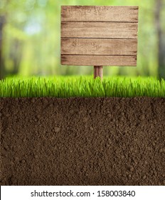 Soil Cut In Garden With Wooden Sign