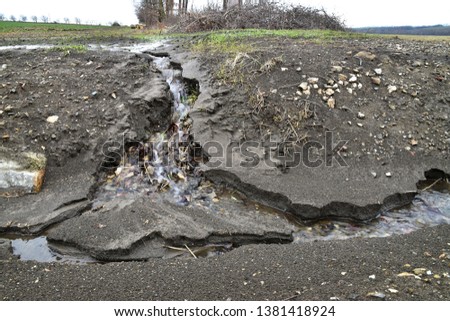 Soil erosion by water lofting earth away