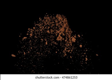 Soil explosion isolated on black background. Abstract cloud of brown ground.