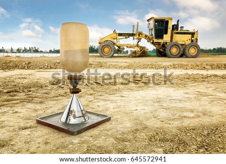 Soil  field density test sand cone method calculation in construction site and construction equipment background for approve soil impact construction in new factory construction