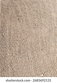 Soil or Mud! Brown ground surface, Close up natural background. Soil wall texture of clay house structure. Fine beach sand, Soil wall of clay house structure, mud background. Vintage Surface