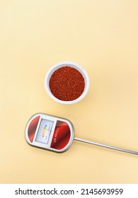 Soil PH Probe Device And White Vase With Sand On A Beige Table