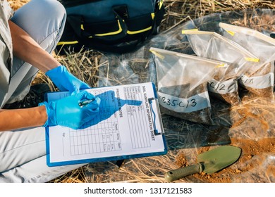 Soil Test. Female Agronomist Taking Notes In The Field. Environmental Protection, Organic Soil Certification, Research