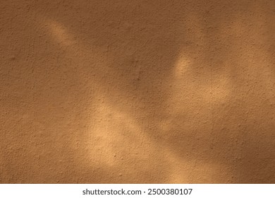 Soil texture of clay house wall with sunlight, home structure made from mud.