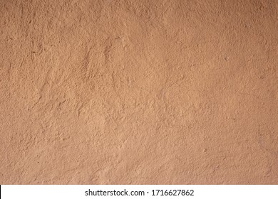 Soil wall texture of clay house structure. Mud background. Soft picture