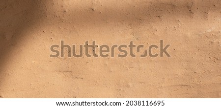 Soil wall texture of clay house structure with light and shadow. Mud background. soft picture
