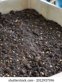 Soil In A Wooden Planter Box.