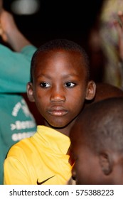 SOKODE, TOGO - JAN 12, 2017: Unidentified Togolese little boy at the evening local show. Children of Togo suffer of poverty due to the bad economy