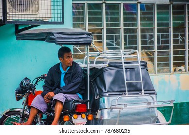 Solano, Nueva Vizcaya/Philippines DEC 17 2017: A Trike Driver Waits For His Next Fare As Trikes Are The Backbone Of Transportation In Rural Philippines