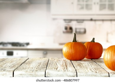 Solar Autumn Pumpkin In The Kitchen On A White Table