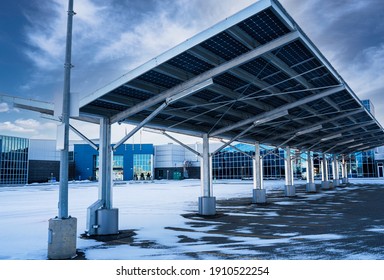 A solar carport for producing renewable energy and electric vehicle charging in Airdrie Alberta Canada.