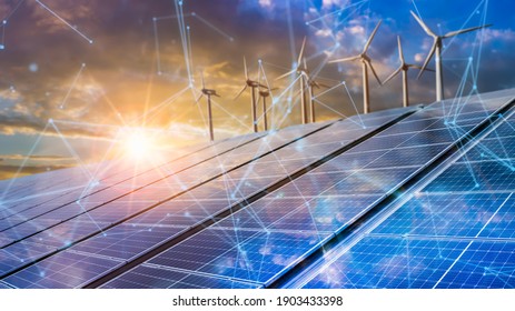 solar cell plant and wind generators in urban area connected to smart grid.Energy supply,eolic turbine,distribution of energy,Powerplant,energy transmission, high voltage supply concept. - Shutterstock ID 1903433398