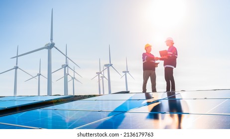 solar cell plant and wind generators in urban area connected to smart grid.Energy supply,wind turbine,eolic turbine,distribution of energy,Powerplant,energy transmission,high voltage supply concept.