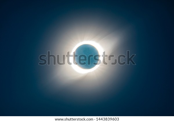 The Solar Corona atmosphere layer during Total\
Solar Eclipse Chile 2019, amazing view of the Sun covered by the\
Moon during totality phase while the Moon covers the entire Sun an\
awesome phenomenom