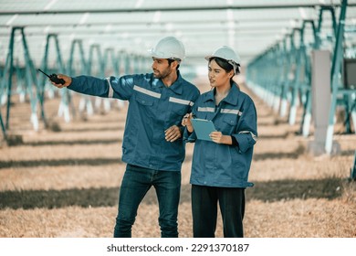 Solar design engineers visually inspect photovoltaic array installation sites for suitable alignment, surface, sunlight access, and structural stability. System maintenance and operation records.