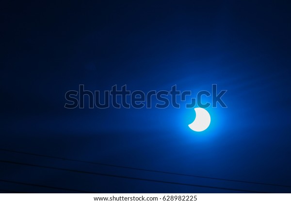 solar eclipse with blue\
filter