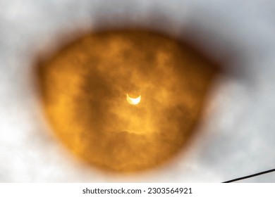 A solar eclipse can be seen in the sky thanks to glasses