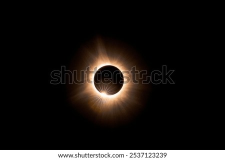 Solar eclipse closeup with sun peeking through 
