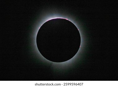 Solar eclipse with glowing corona, black silhouette of the moon obscuring the sun during total eclipse in dark sky. Corona around total solar eclipse. Elements of this image furnished by NASA