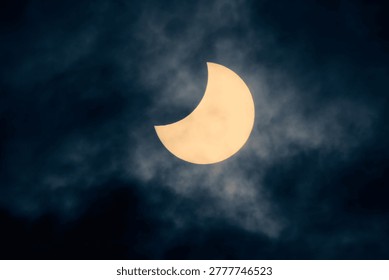 Solar eclipse view through a telescope and a special solar filter.