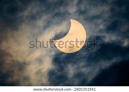 Solar eclipse view through a telescope and a special solar filter.