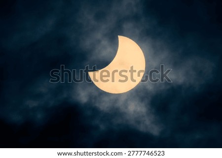 Solar eclipse view through a telescope and a special solar filter.