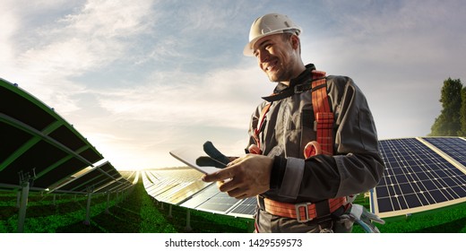 Solar Energy Engineer Using Tablet For Check Power Station 