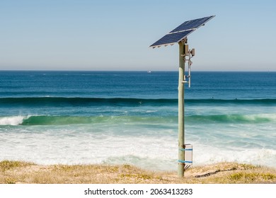 Solar energy panel photovoltaic cell on the pole near the ocean. Renewable energy. Enviroinment conservation and power saving. Solar powered equipment at Cronulla, NSW, Australia
