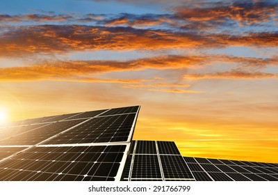 Solar Energy Panels Against Sunset Sky