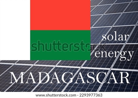 Solar energy panels with Madagascar flag background.  Sustainable resources and renewable malagasy energy concept.