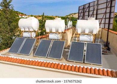 Solar Energy. Solar Panels On The Roof Of The House. Electric Energy From The Sun. Roof Office. Barrels Of Water Are Heated By Sunlight. Alternative Energy Sources. Concept - Sale Of Solar Panels