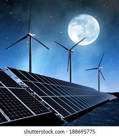 solar energy panels and wind turbines in night