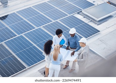 Solar energy, teamwork or engineering designers with blueprint on roof building grid technology for innovation. Collaboration, top view or business people talking or planning a development project - Powered by Shutterstock