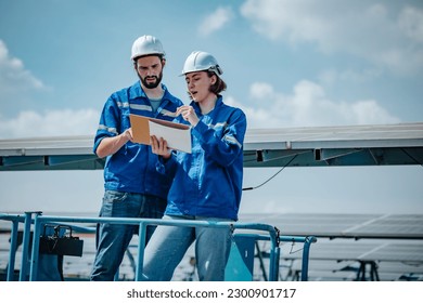 Solar engineers visually examine panel arrays on farm sites using blueprints and drawings to ensure that the alignment, surface, sunlight access, and structural stability meet standard requirements.