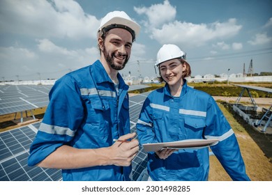 Solar engineers visually examine panel arrays on farm sites using blueprints and drawings to ensure that the alignment, surface, sunlight access, and structural stability meet standard requirements.