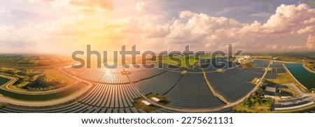 Solar Farm (solar cell) at sunset sky background. Renewable green alternative energy. Power plant. Solar photovoltaic rows array of ground mount system Installation.