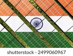 Solar farm superimposed with flag of India. Symbolizing solar power and panel demand, renewable energy industry, government policy, and sustainability initiatives in the country.