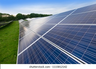 Solar Farm In UK, Photovoltaic Panels In Green Field.Solar Energy Is Part Of The Net Zero Emissions Target For The UK