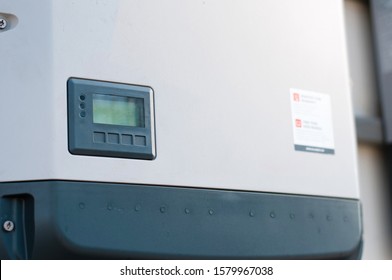 Solar Inverter On The Side Of A House	