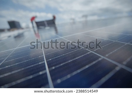 Solar panel array on on a warehouse roof. The implementation of a solar panel system.